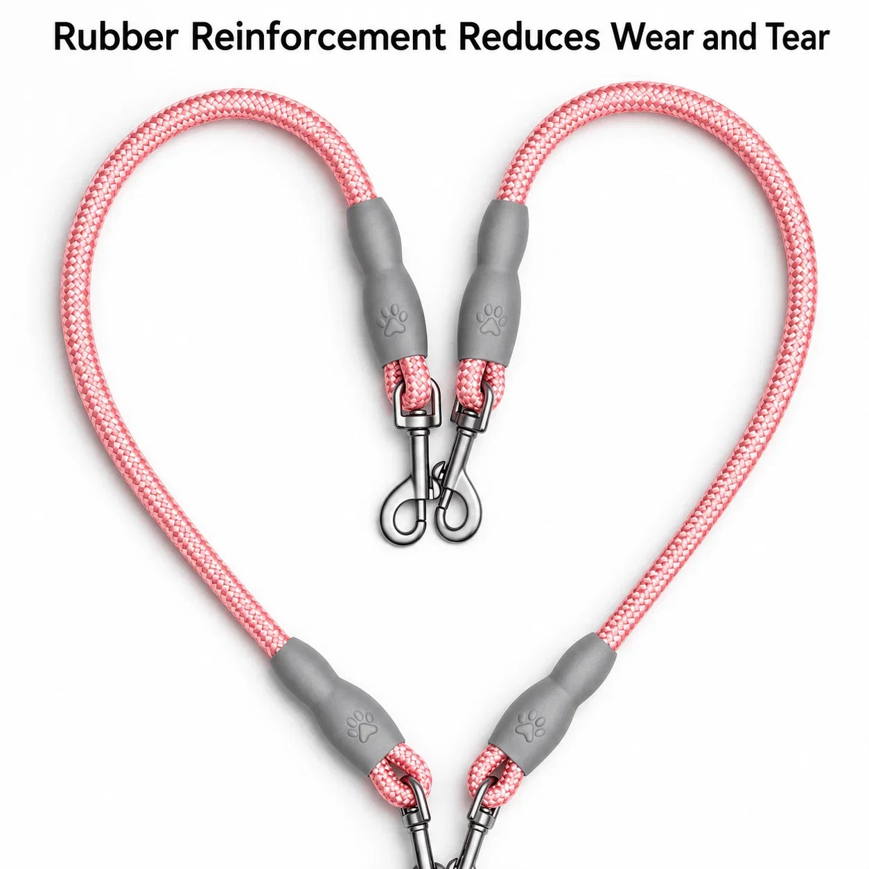 Two pink braided pet leash lines with gray reinforced rubber end caps and metal clip attachments, arranged in a heart shape on a white background with text at the top reading 'Rubber Reinforcement Reduces Wear and Tear'.