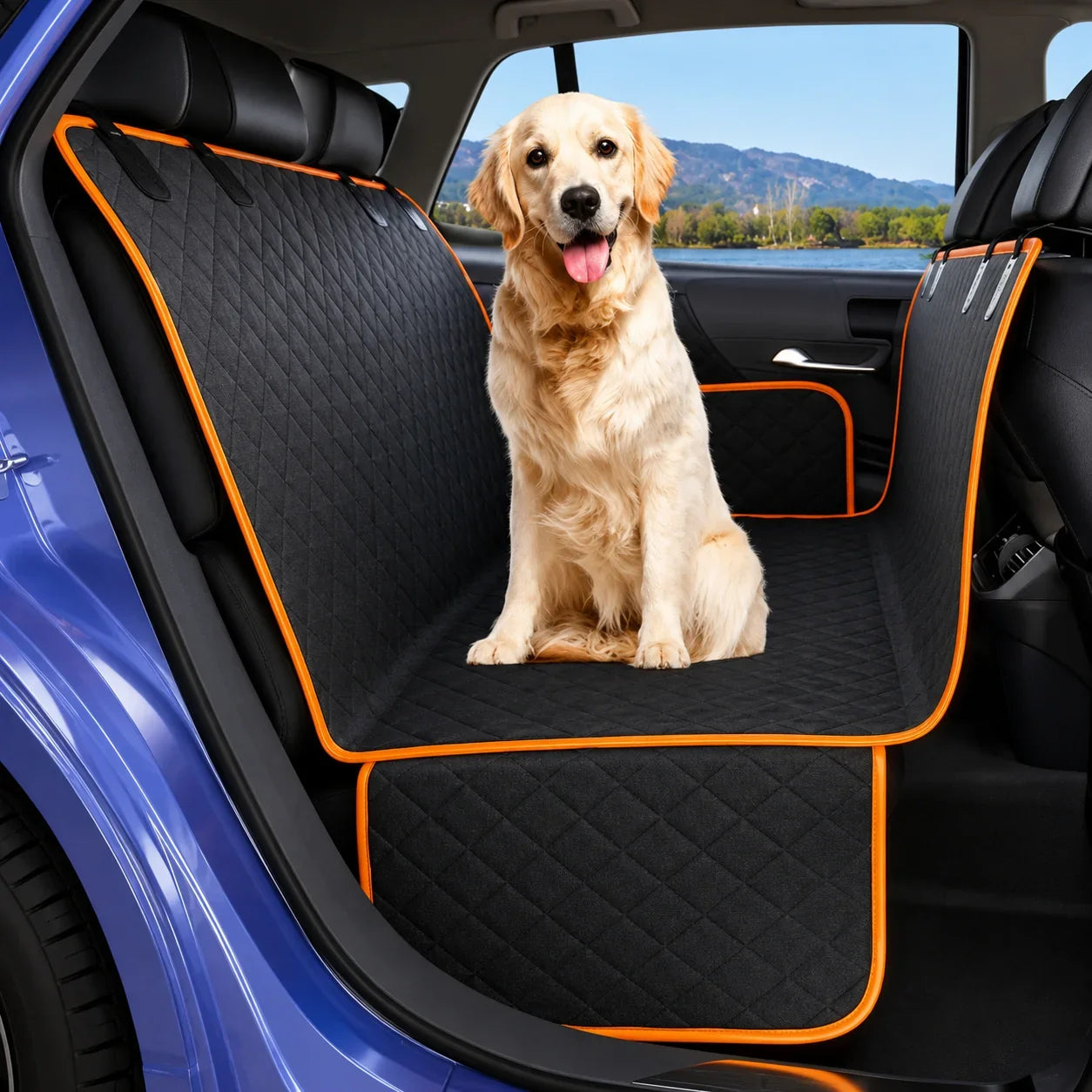 A golden retriever dog sits on a black quilted car backseat cover with bright orange trim inside a blue car. The cover extends across the rear seat and includes side panels.