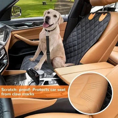 Dog sitting on a car seat cover with scratch-proof feature, inside a vehicle.